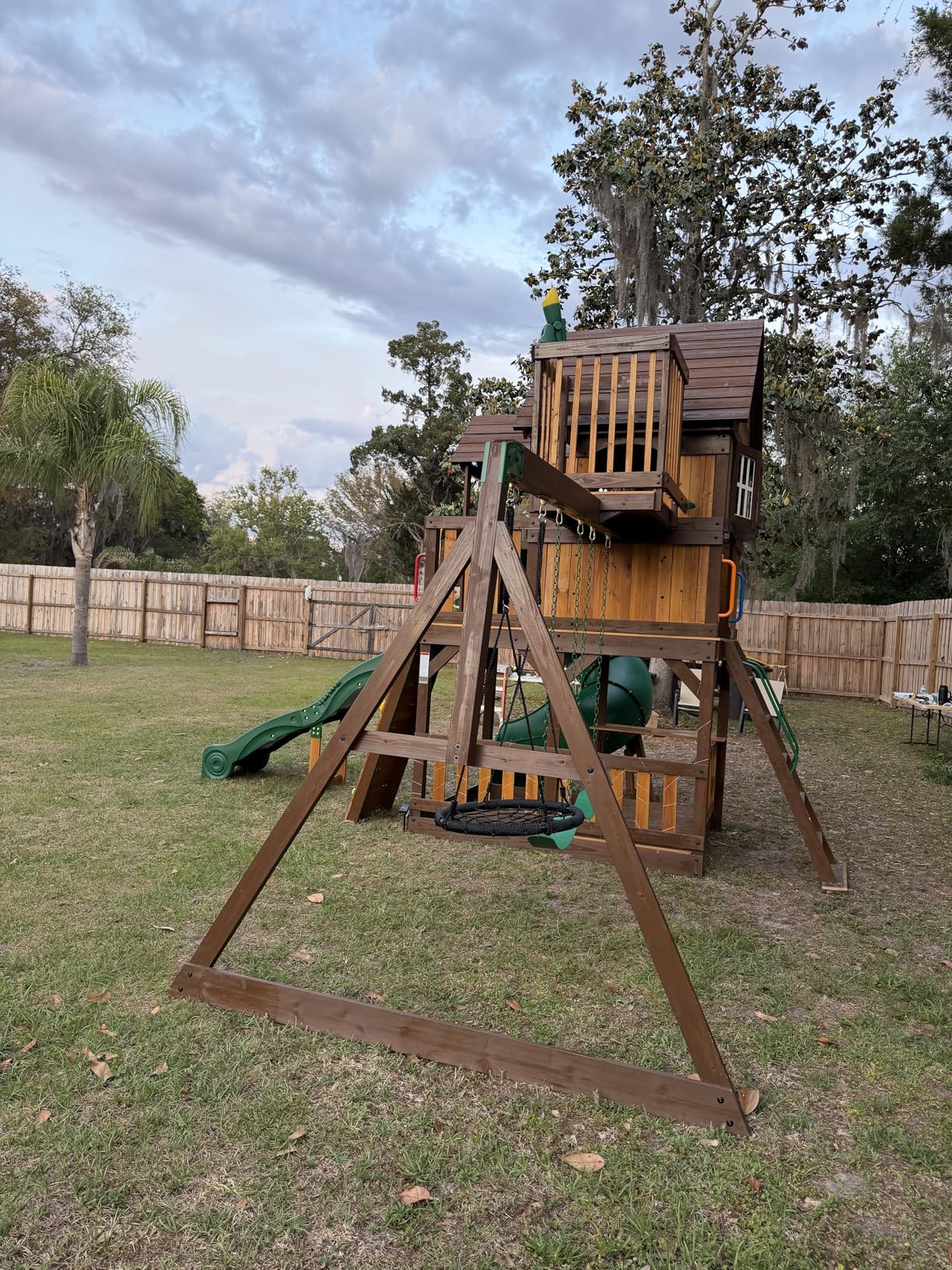 Backyard Discovery Skyfort All Cedar Swing Set, Elevated Covered Wood Roof Clubhouse with Bay Windows, 2 Belt Swings, Web Swing, 10ft Wave Slide, 5 ft Tube Slide, Covered Picnic Table, 5 ft Rock Wall customer photo 1
